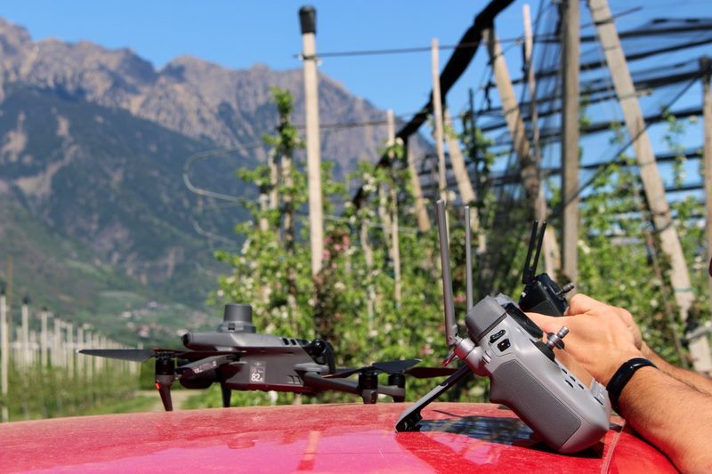 RTK drone ready for flight in orchard — pre-upload